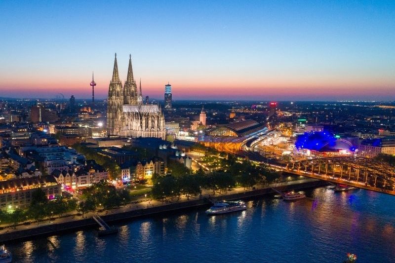 Cologne cityscape with Cologne Cathedral and Rhine River at sunset, popular study destination in Germany for international students
