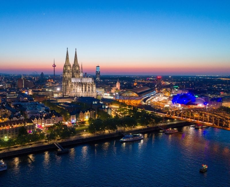 Cologne cityscape with Cologne Cathedral and Rhine River at sunset, popular study destination in Germany for international students